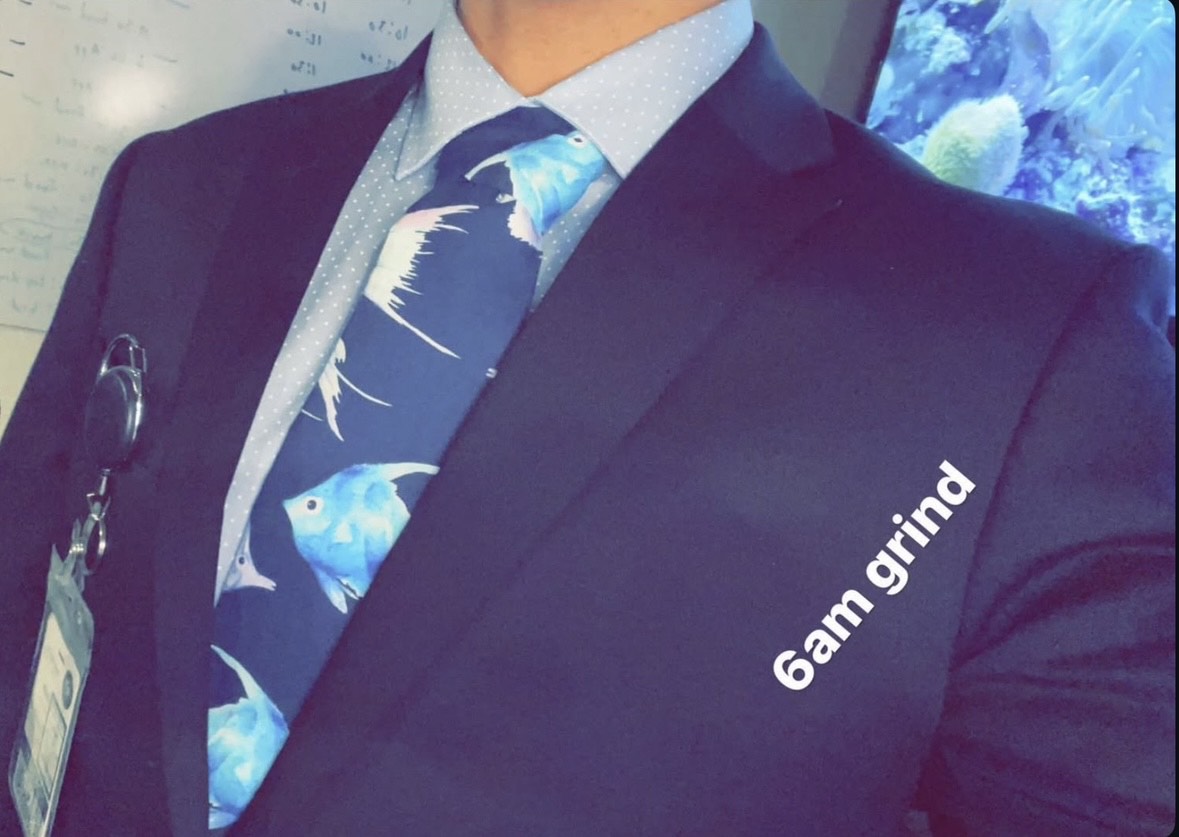 Justin in suit and tie — featured